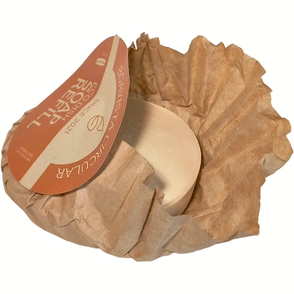 Beige rond stuk Boavista vaste afwaszeep navulling verpakt in bruin papier zonder plastic