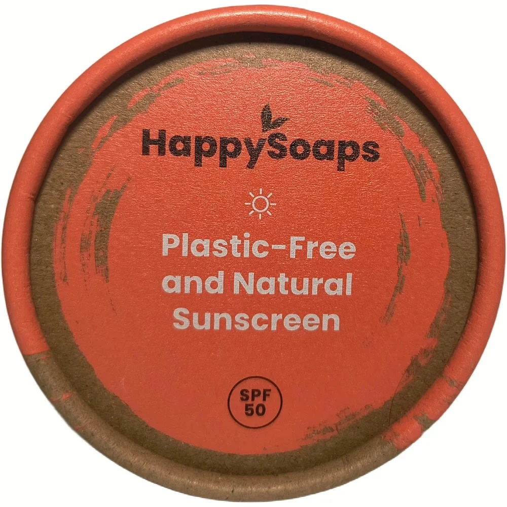 Bovenaanzicht van de kartonnen verpakking van HappySoaps plasticvrije en natuurlijke zonnebrand met SPF 50