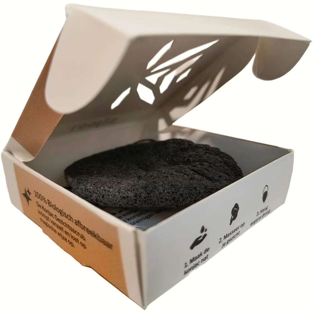Geopend doosje van Loofys Konjac Gezichtsscrub met zwarte konjacspons en gebruiksinstructies