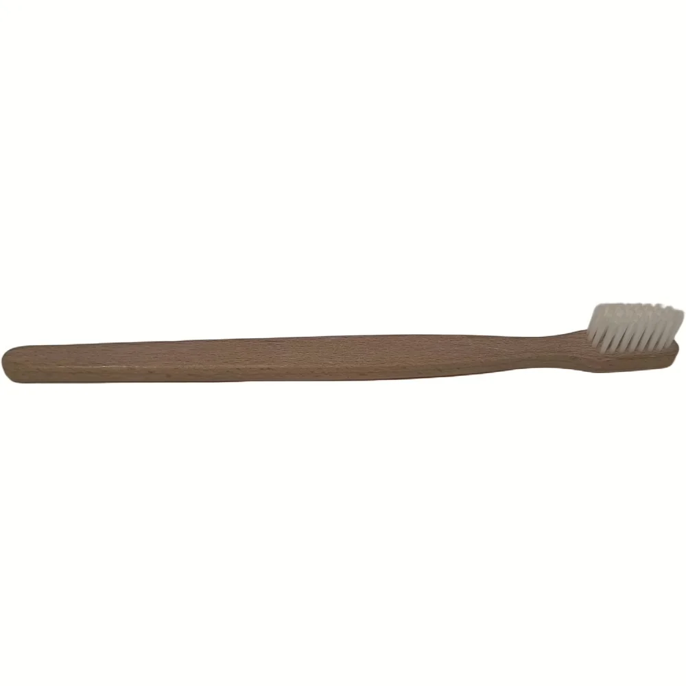 Zijkant van de Purely Wood tandenborstel met beukenhouten handvat en witte nylon haren voor volwassenen