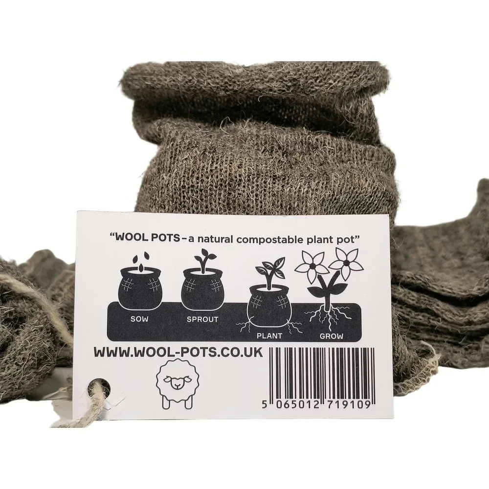 Wool Pots biologische kweekpotjes van schapenwol met etiket dat uitleg geeft over zaaien, ontkiemen, planten en groeien
