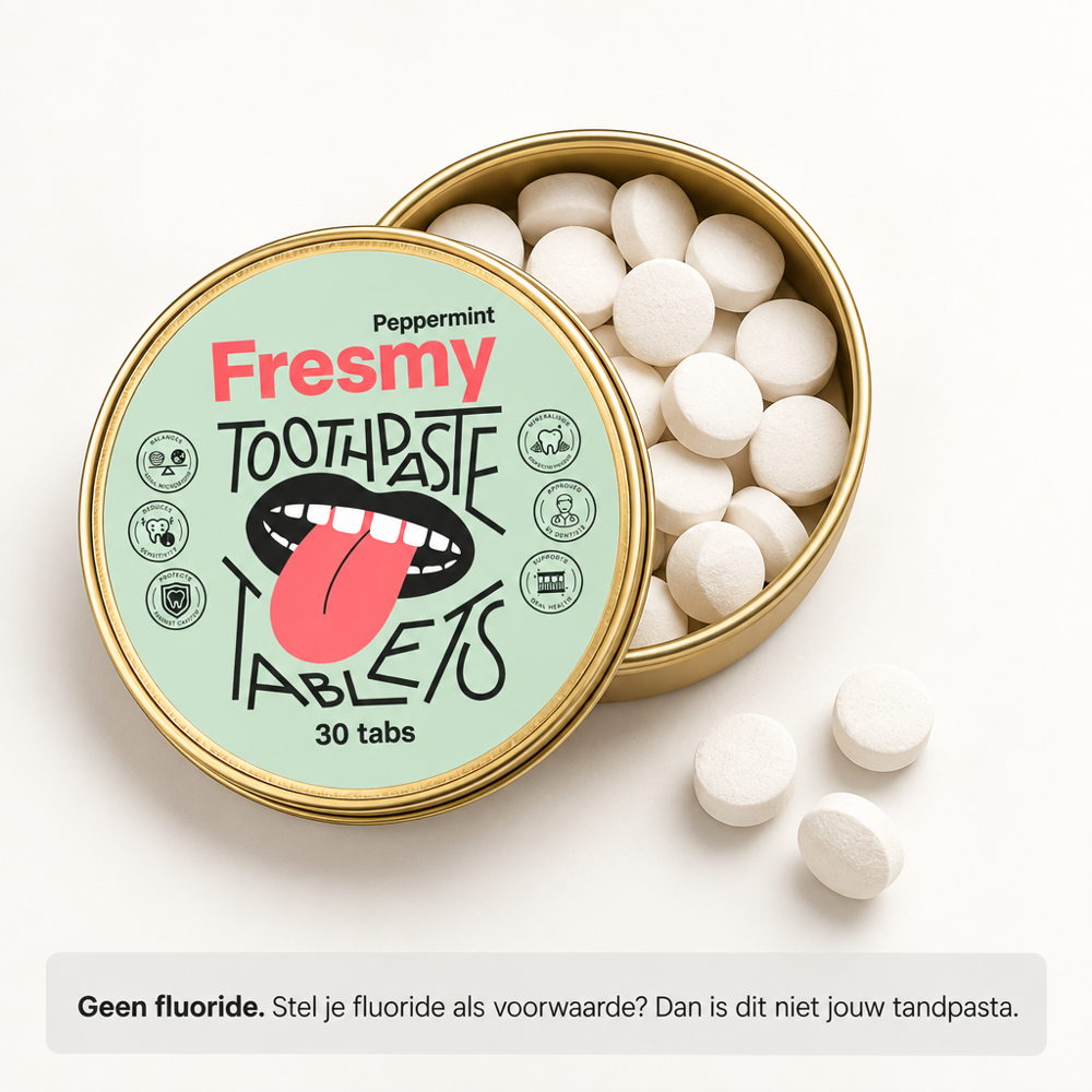 Geopend blikje Fresmy Tandpasta Tablets met losse tabletten, zonder fluoride